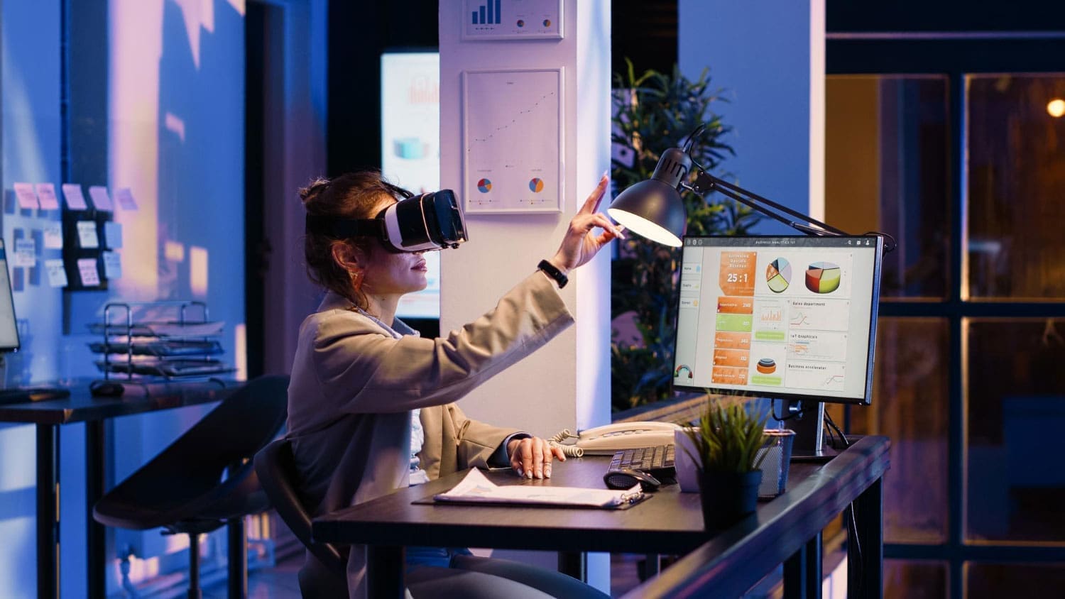 Young businesswoman working with VR glasses